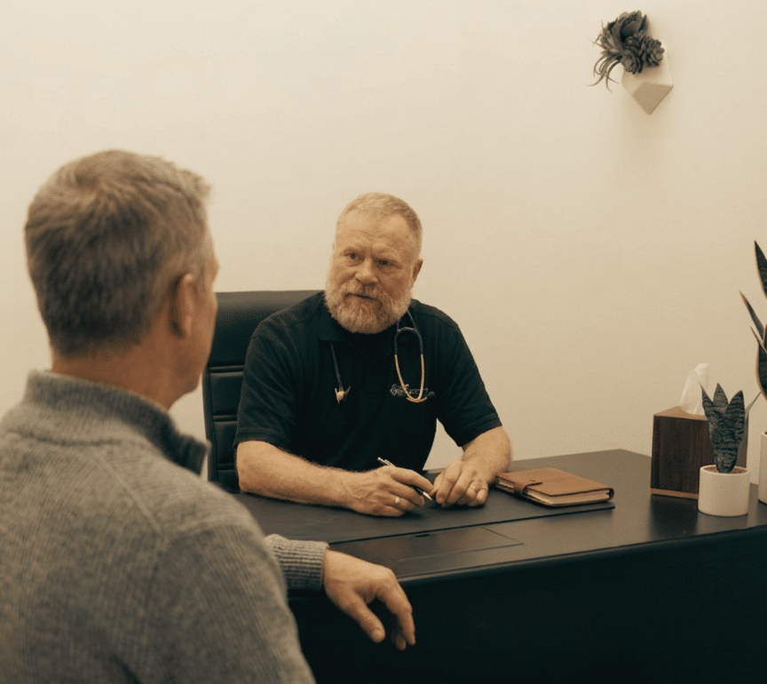 Dr. Kevin Lokkesmoe consulting with a patient about medical weight loss in Cumming, GA at Good Chemistry