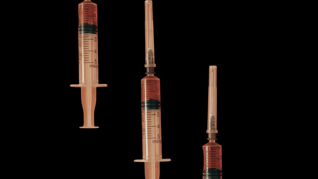 Methylcobalamin in three syringes arranged on a dark background at Good Chemistry Med Spa for B12 injections in Cumming, GA
